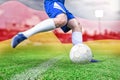 Composite image of football player kicking ball Royalty Free Stock Photo