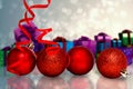 Composite image of four red christmas ball decorations