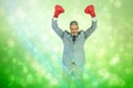 Composite image of furious businessman posing with red boxing gloves Royalty Free Stock Photo