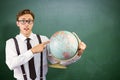 Composite image of geeky businessman pointing to globe Royalty Free Stock Photo