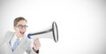 Composite image of geeky businessman shouting through megaphone Royalty Free Stock Photo