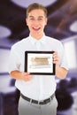 Composite image of geeky businessman showing his tablet pc Royalty Free Stock Photo