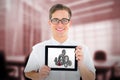 Composite image of geeky businessman showing his tablet pc Royalty Free Stock Photo