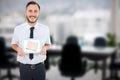 Composite image of geeky businessman showing his tablet pc Royalty Free Stock Photo