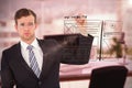 Composite image of geeky businessman writing with marker Royalty Free Stock Photo