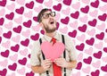 Composite image of geeky hipster crying and holding heart card Royalty Free Stock Photo