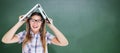 Composite image of geeky hipster holding her laptop over her head Royalty Free Stock Photo