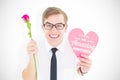 Composite image of geeky hipster holding a red rose and heart card