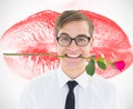 Composite image of geeky hipster holding a red rose in his teeth Royalty Free Stock Photo