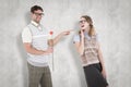 A Composite image of geeky hipster holding rose and pointing his girlfriend Royalty Free Stock Photo