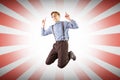 Composite image of geeky hipster jumping and pointing