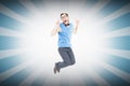 Composite image of geeky hipster jumping and smiling