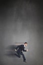 Composite image of geeky young businessman running mid air Royalty Free Stock Photo