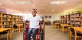 Composite image of girl sitting in wheelchair in school corridor Royalty Free Stock Photo