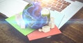 Composite image of globe and cardboard boxes Royalty Free Stock Photo