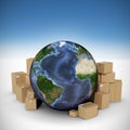 Composite image of globe surrounded by cardboard boxes Royalty Free Stock Photo