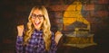 Composite image of gorgeous blonde hipster celebrating success Royalty Free Stock Photo