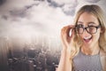 Composite image of gorgeous blonde hipster winking Royalty Free Stock Photo