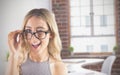 Composite image of gorgeous blonde hipster winking Royalty Free Stock Photo