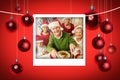 Composite image of grandfather in santa hat carving chicken at christmas dinner Royalty Free Stock Photo