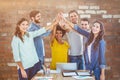 Composite image of group of young colleagues using laptop Royalty Free Stock Photo