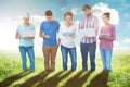 Composite image of group of young colleagues using laptop and tablet Royalty Free Stock Photo