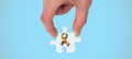 Composite image of hand holding jigsaw piece Royalty Free Stock Photo