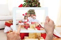 Composite image of hand holding tablet pc Royalty Free Stock Photo