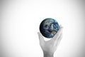 Composite image of hand presenting little earth Royalty Free Stock Photo