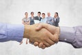 Composite image of hand shake in front of wires Royalty Free Stock Photo