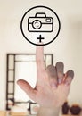 Composite image of hand touching photo camera icon Royalty Free Stock Photo