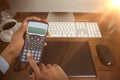 Composite image of hands of businessman using calculator Royalty Free Stock Photo