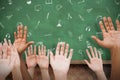 Composite image of hands raising in the air Royalty Free Stock Photo