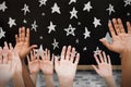 Composite image of hands raising in the air Royalty Free Stock Photo