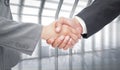 Composite image of handshake between two business people Royalty Free Stock Photo