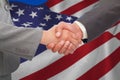 Composite image of handshake between two business people Royalty Free Stock Photo