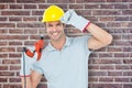 Composite image of handsome architect holding drill machine Royalty Free Stock Photo