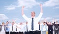 Composite image of handsome businessman cheering with arms up Royalty Free Stock Photo