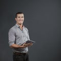 Composite image of handsome businessman using digital tablet over white background Royalty Free Stock Photo