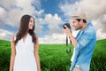 Composite image of handsome hipster taking a photo of pretty girlfriend Royalty Free Stock Photo