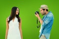 Composite image of handsome hipster taking a photo of pretty girlfriend Royalty Free Stock Photo