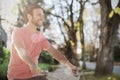 Composite image of handsome man on a bike ride on a sunny day Royalty Free Stock Photo