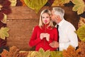 Composite image of handsome man giving his wife a kiss on cheek Royalty Free Stock Photo