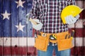 Composite image of handyman holding hard hat and hammer Royalty Free Stock Photo