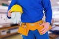 Composite image of handyman holding helmet Royalty Free Stock Photo