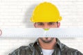 Composite image of handyman looking at spirit level Royalty Free Stock Photo