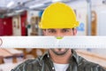 Composite image of handyman looking at spirit level Royalty Free Stock Photo