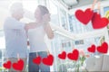 Composite image of hanging red hearts and mature couple dancing Royalty Free Stock Photo