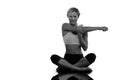 Composite image of happy blonde sitting in lotus pose stretching arms Royalty Free Stock Photo