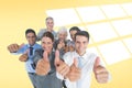 Composite image of happy business people looking at camera with thumbs up Royalty Free Stock Photo